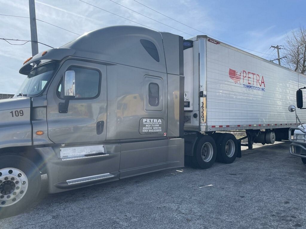 Petra transportation grey truck with Freightliner Cascadia